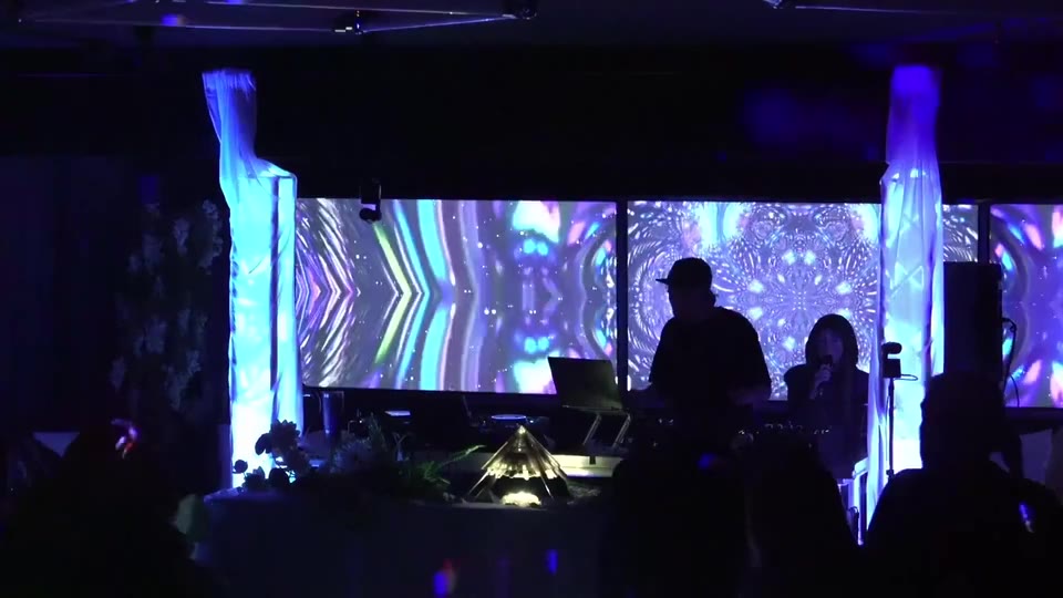The ceremony hour: the projection walls come alive as the room settles in
