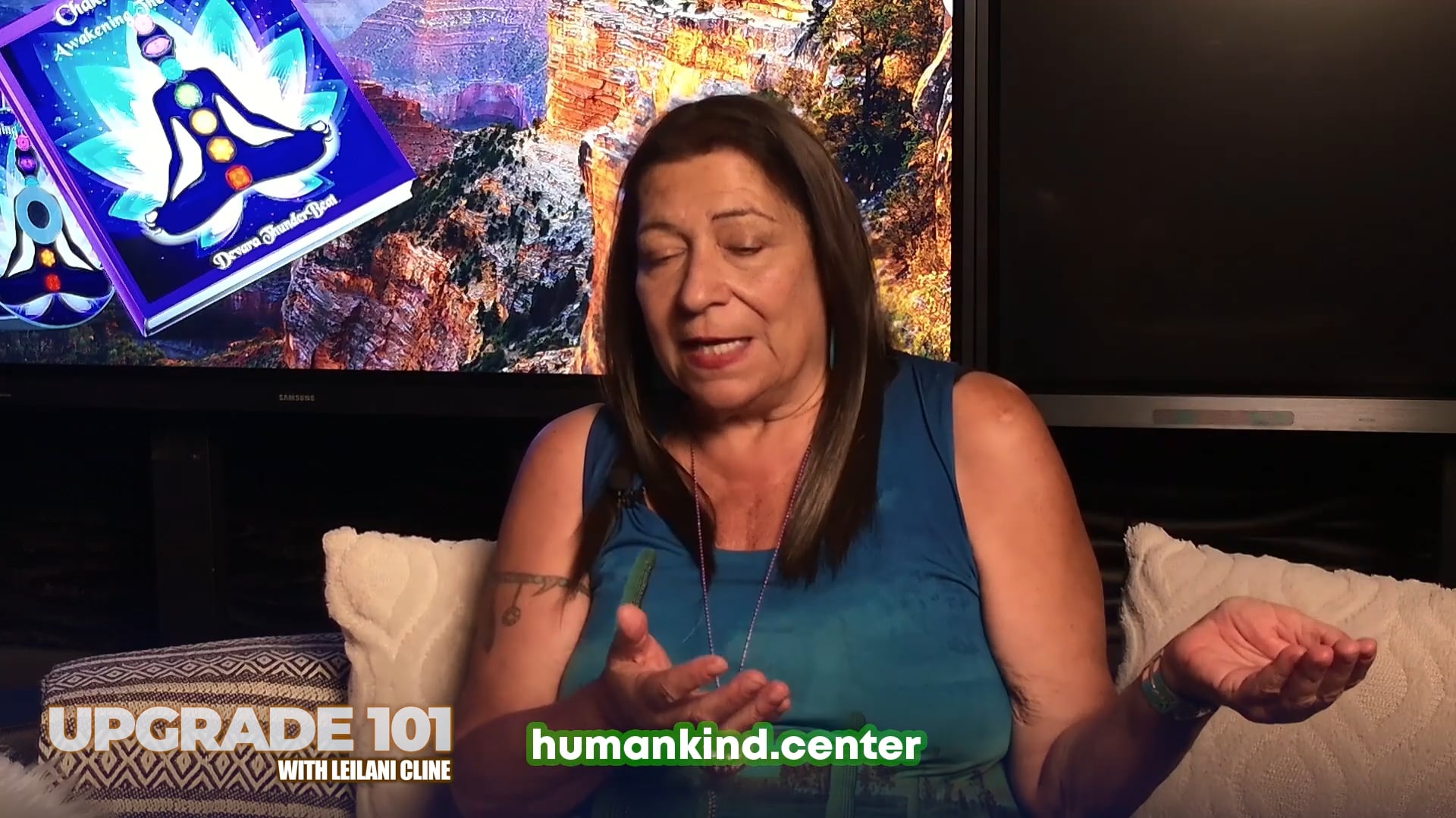 Thunderbeat, with her chakra book on the screen behind her, tells the story of Chakra Journey.