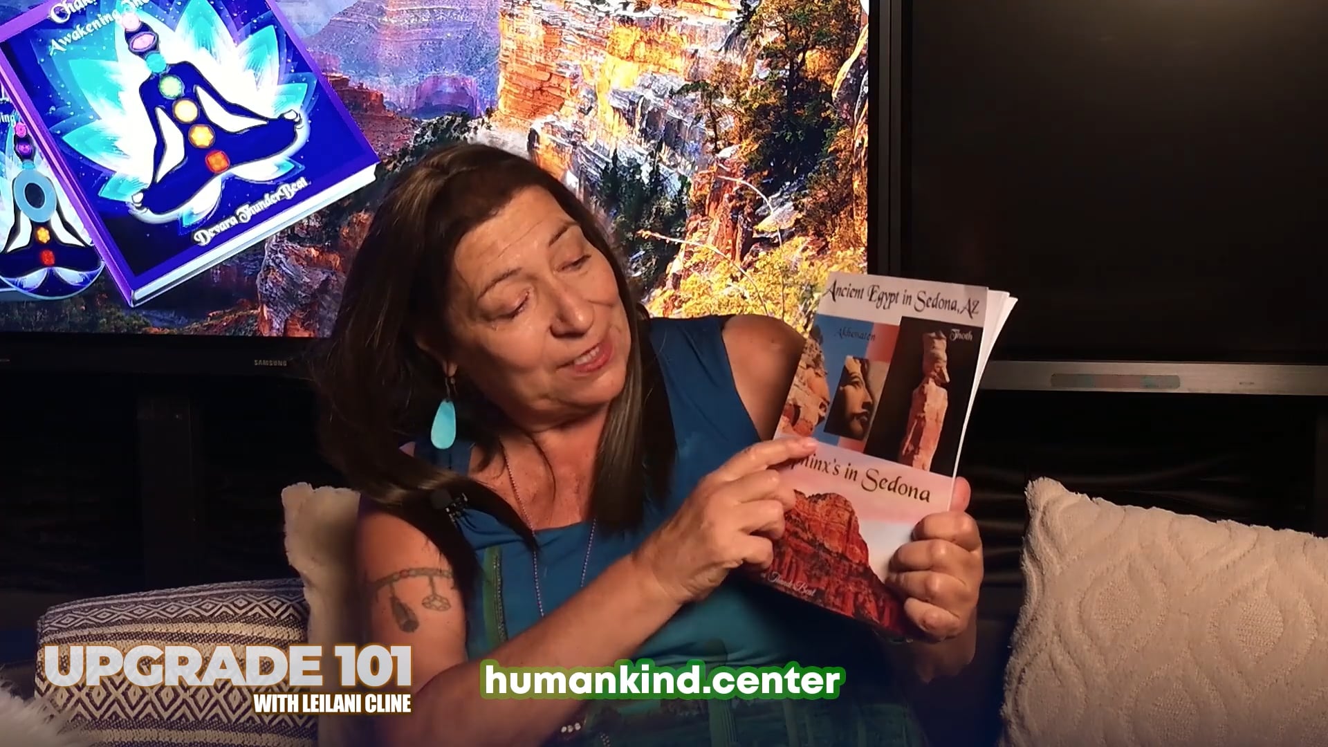 Thunderbeat holds up her book, Ancient Egypt in Sedona, AZ, the result of a twenty-year project.